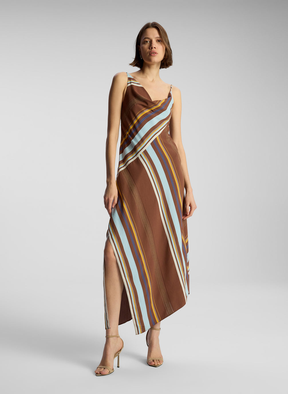 front view of woman wearing brown striped midi dress