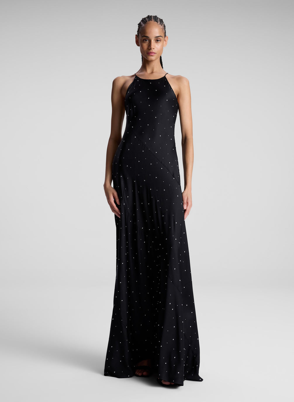 woman wearing black embellished maxi dress