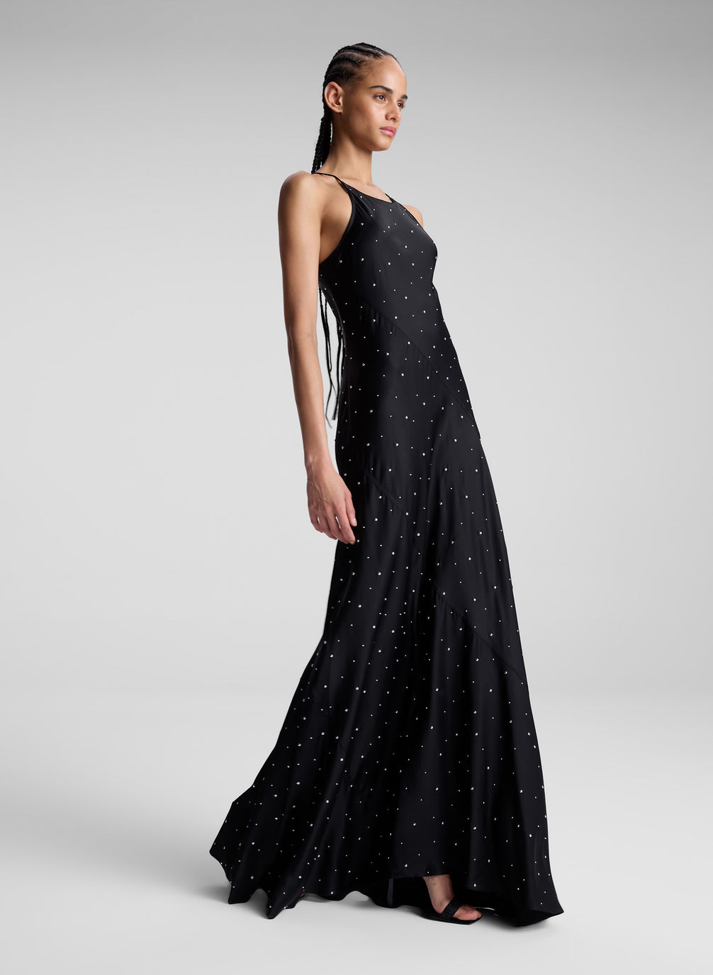 woman wearing black embellished maxi dress