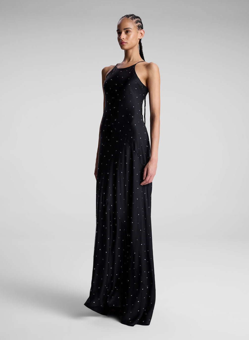 woman wearing black embellished maxi dress