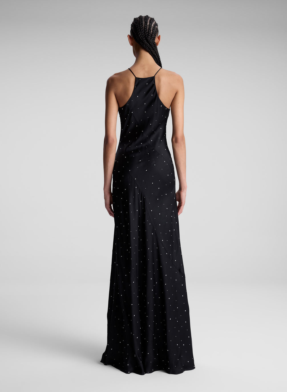 woman wearing black embellished maxi dress