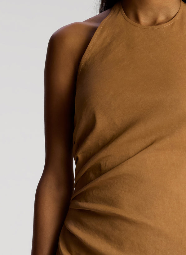 detail view of woman wearing brown sleeveless midi dress