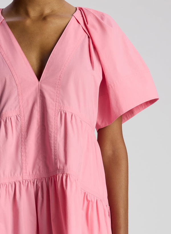 detail view of woman wearing pink short sleeve minidress