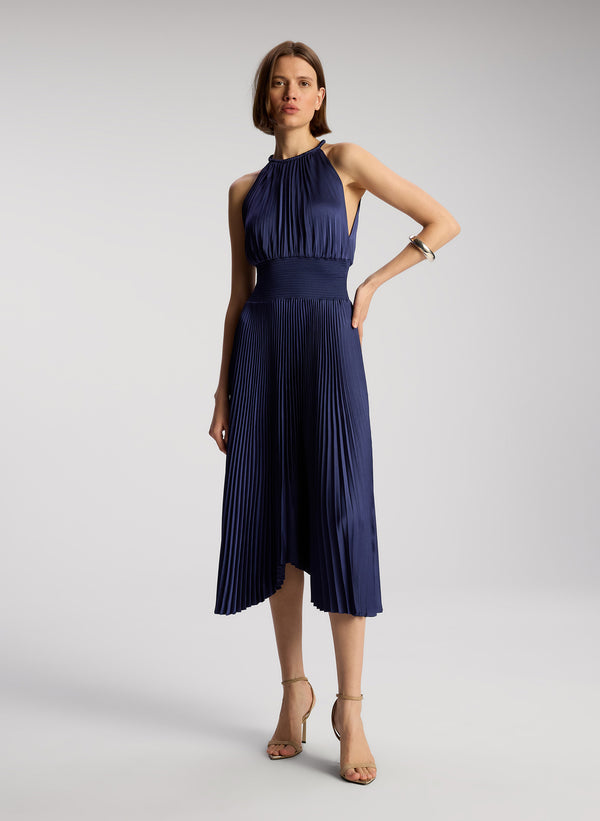 front view of woman wearing navy blue sleeveless pleated midi dress