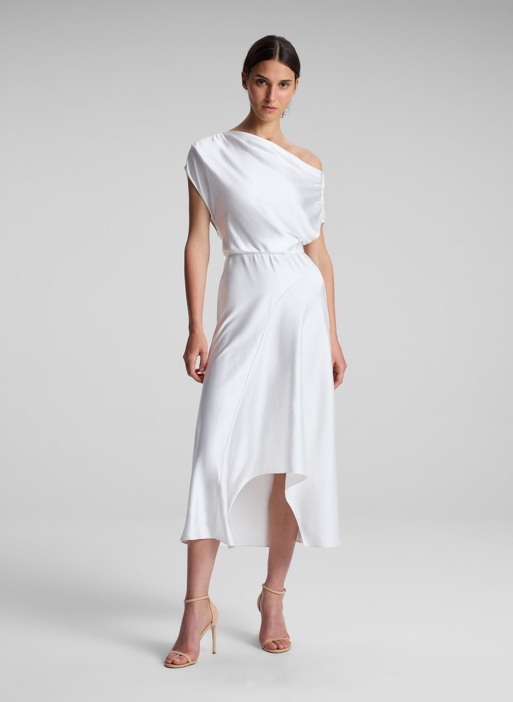 woman wearing white satin midi dress