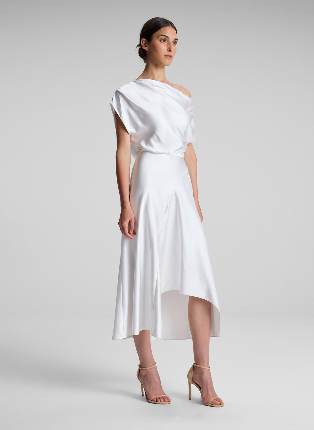 woman wearing white satin midi dress