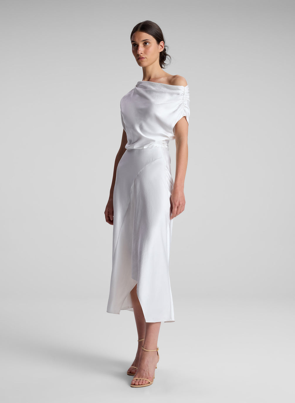 woman wearing white satin midi dress