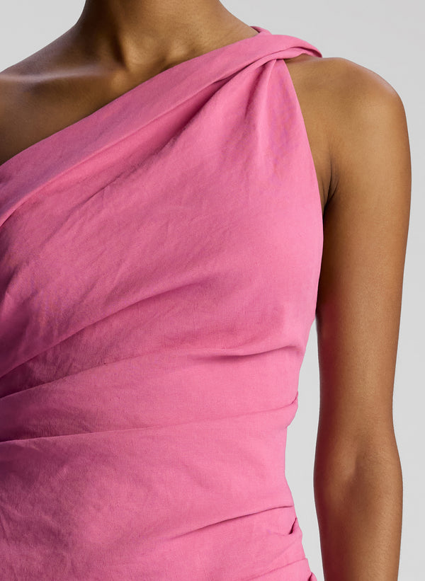 detail view of woman wearing pink one shoulder mini dress