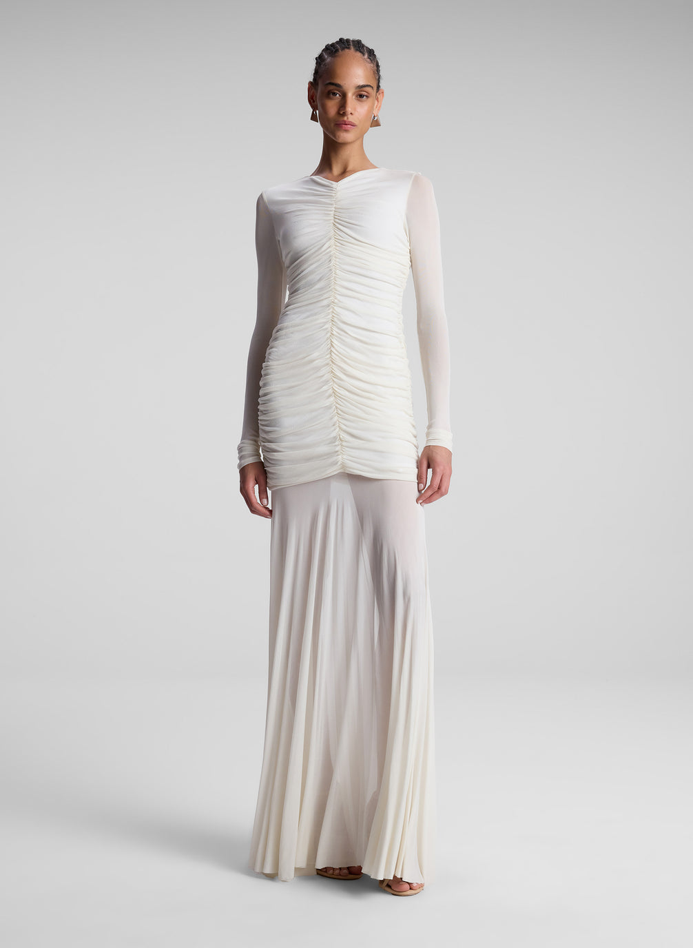 woman wearing white ruched long sleeve maxi dress