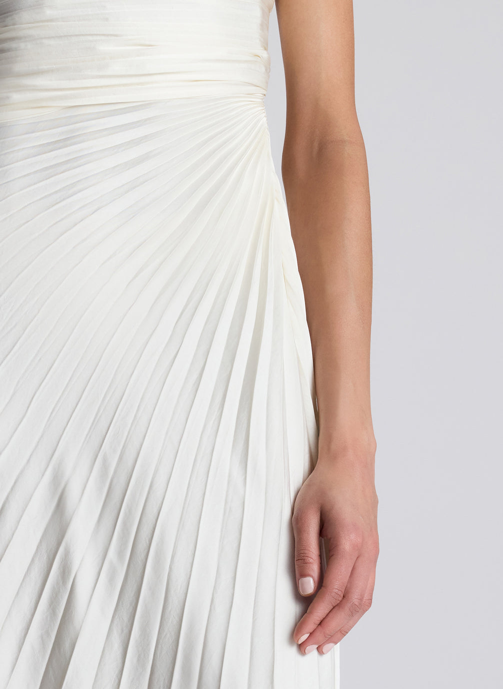 Woman Wearing White Strapless Pleated Maxi Dress