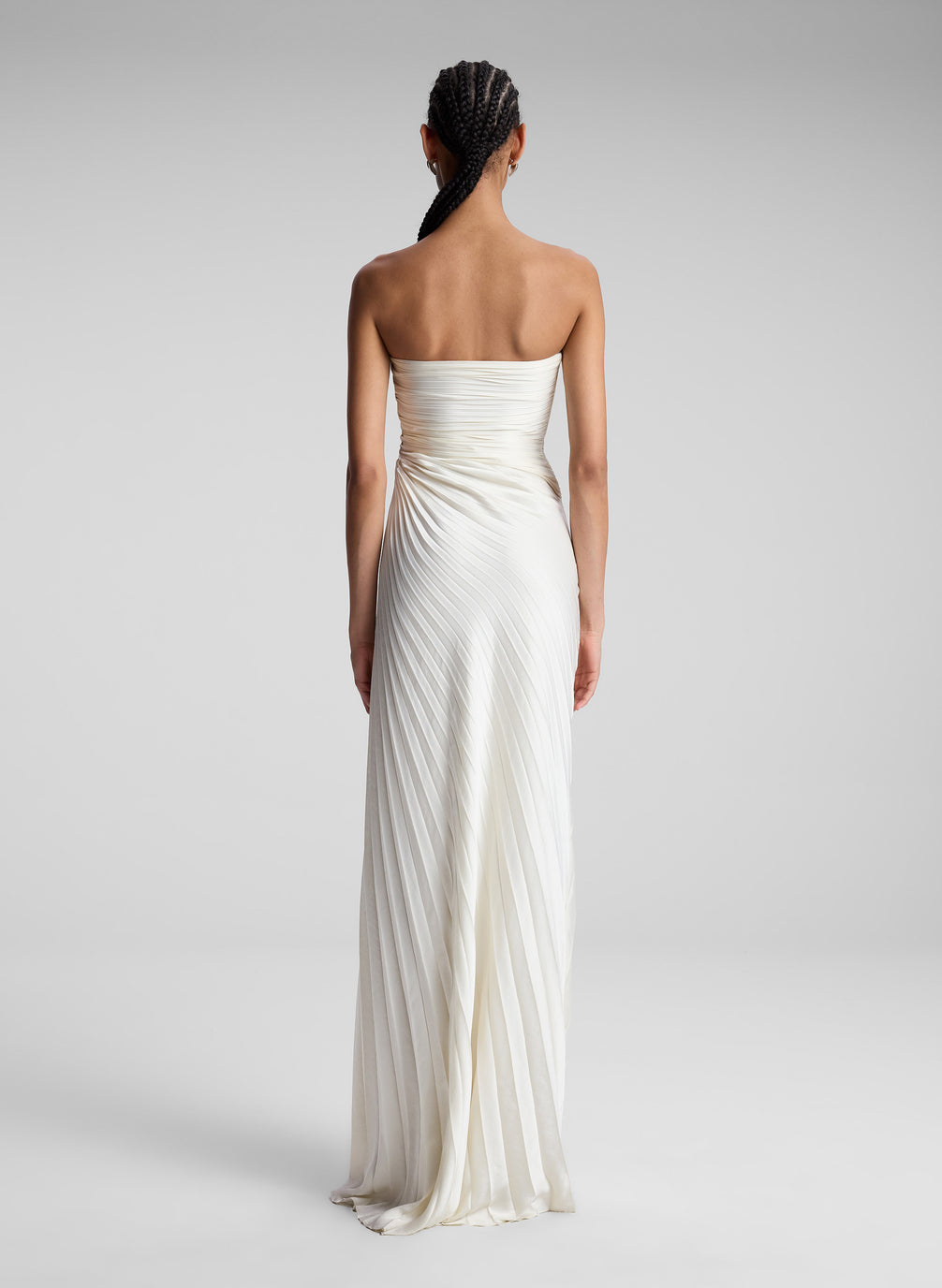 Woman Wearing White Strapless Pleated Maxi Dress