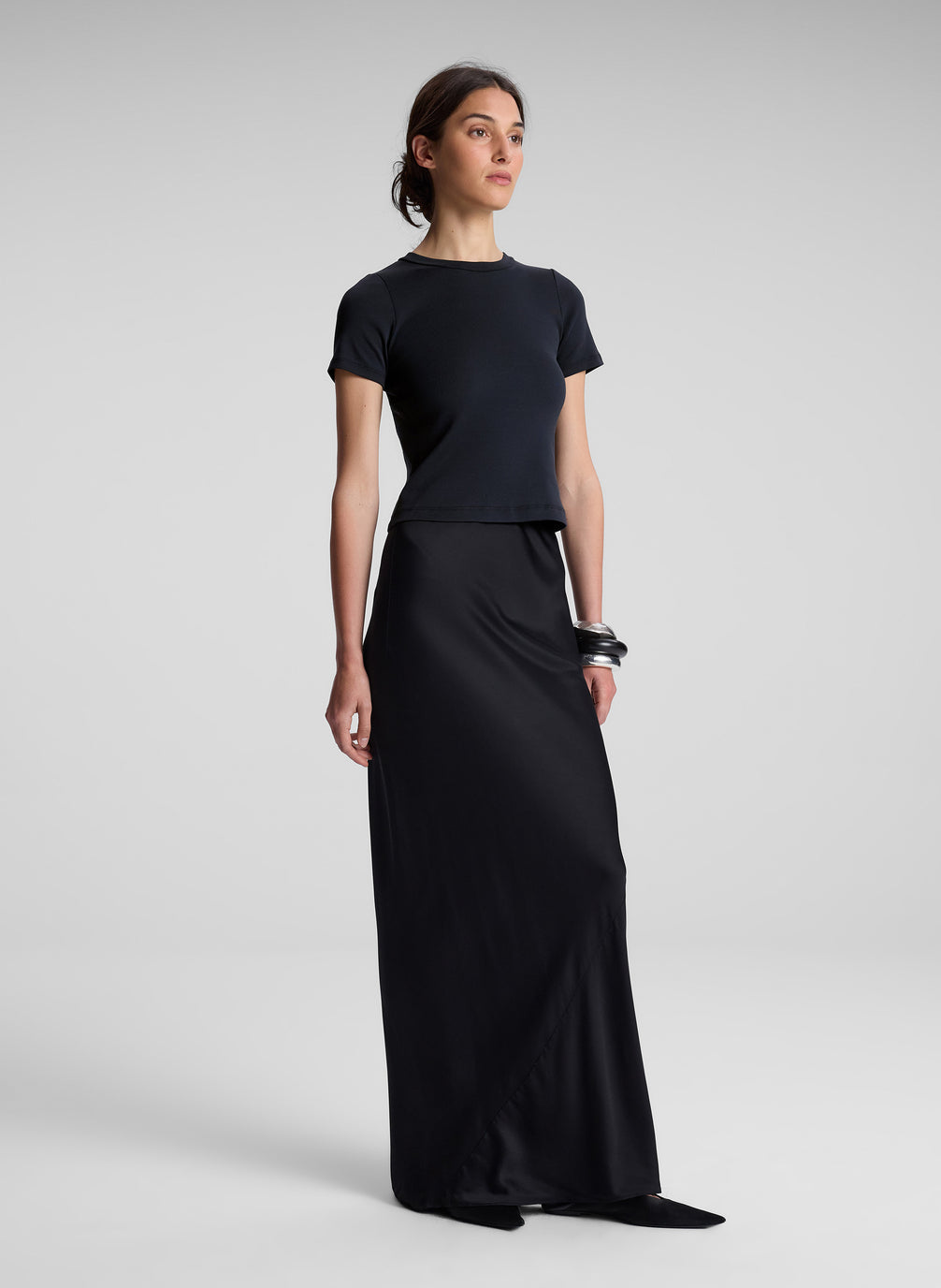 woman wearing black tee shirt and black maxi skirt