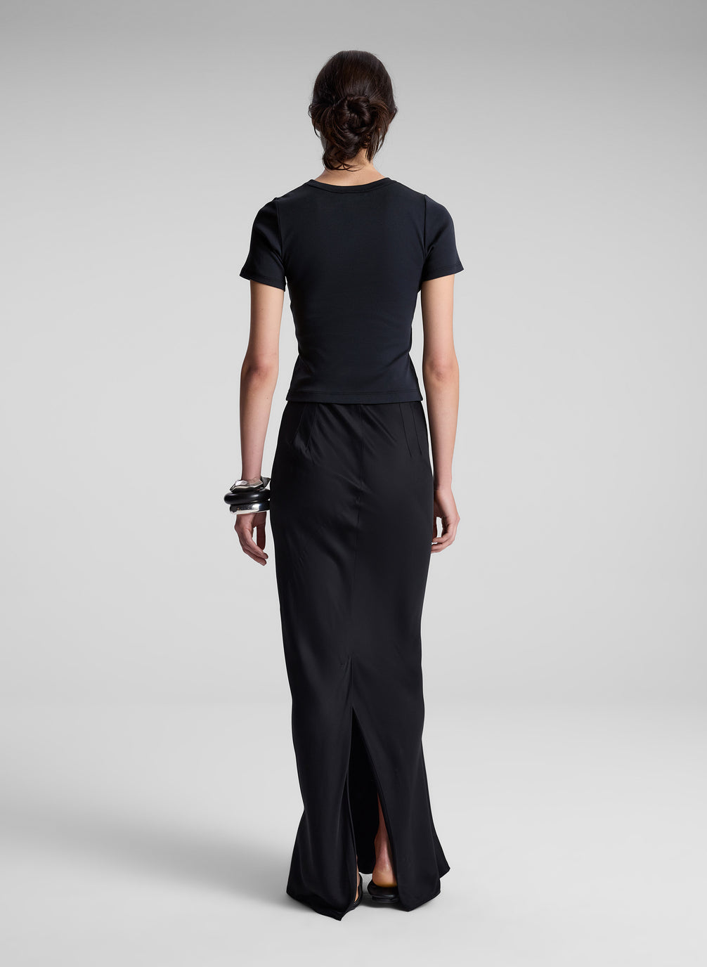 woman wearing black tee shirt and black maxi skirt