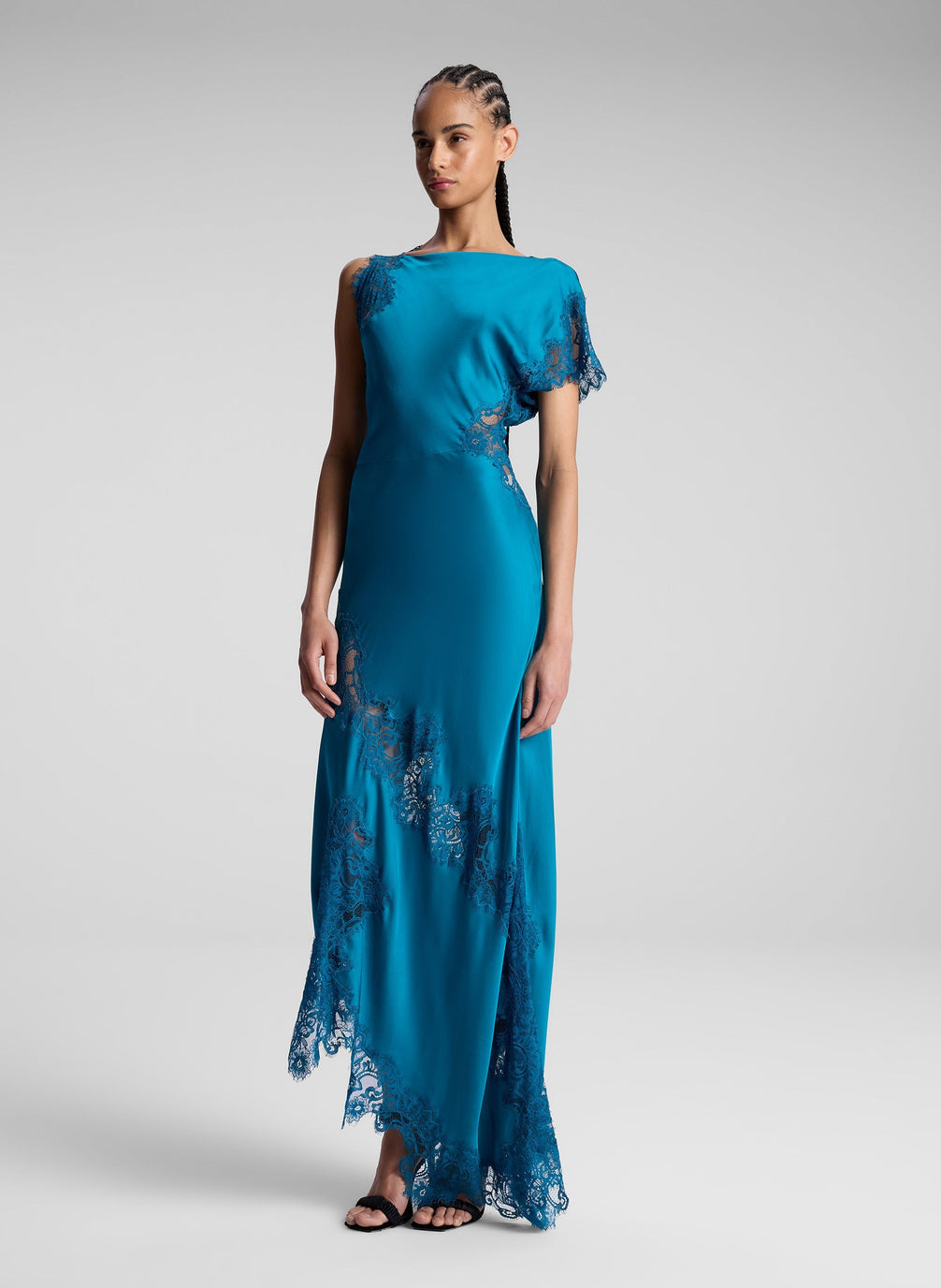 woman wearing teal lace maxi dress