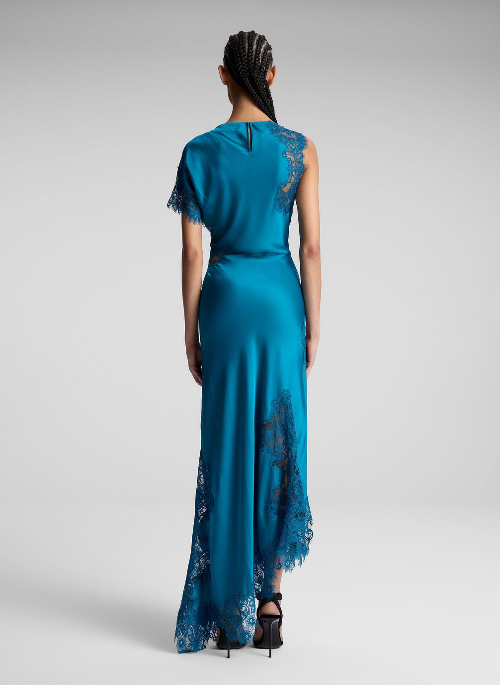 woman wearing teal lace maxi dress