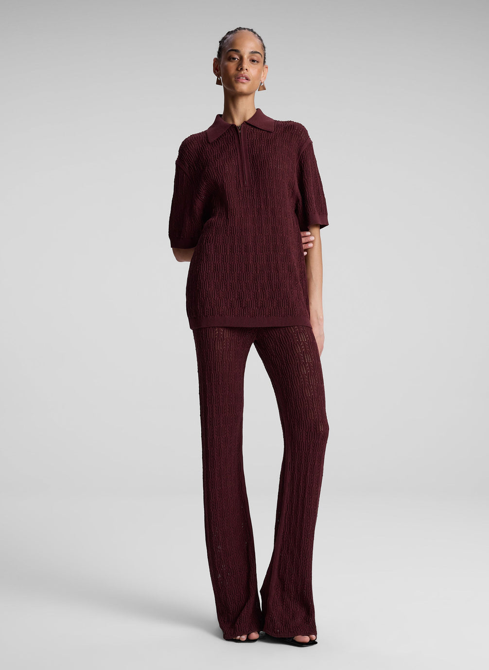 woman wearing burgundy knit pant and shirt set