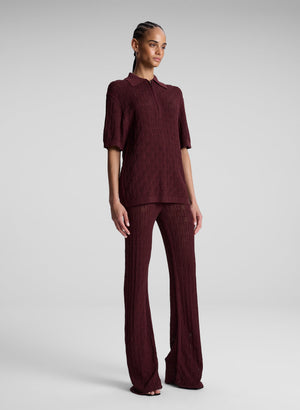 woman wearing burgundy knit pant and shirt set