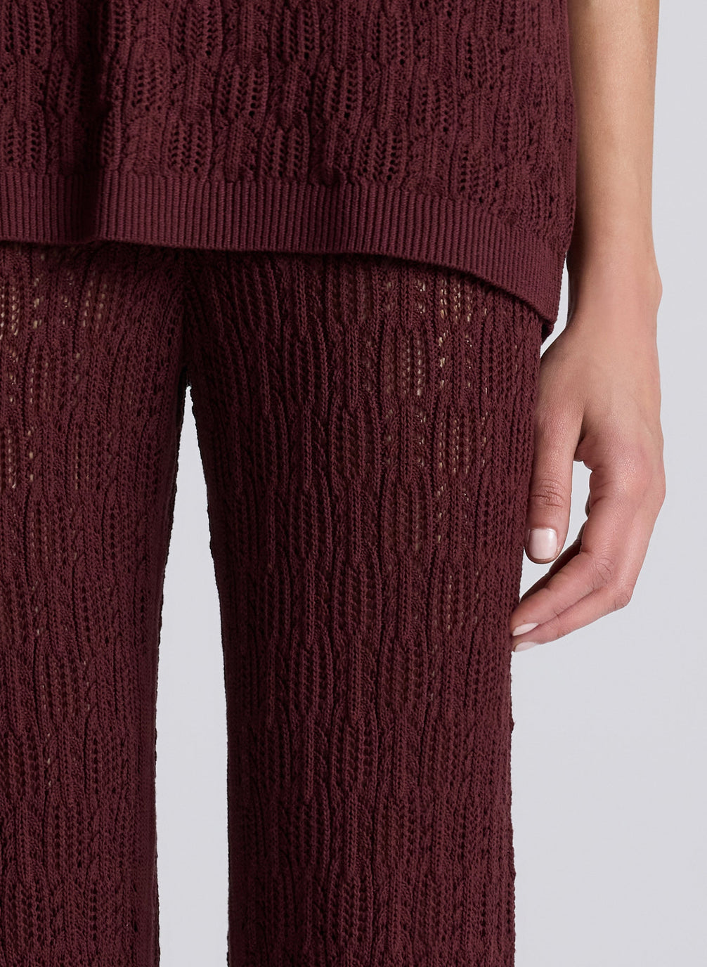 woman wearing burgundy knit pant and shirt set