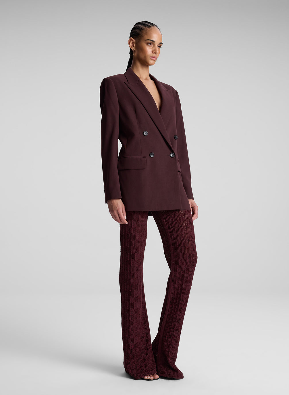 woman wearing brown suit