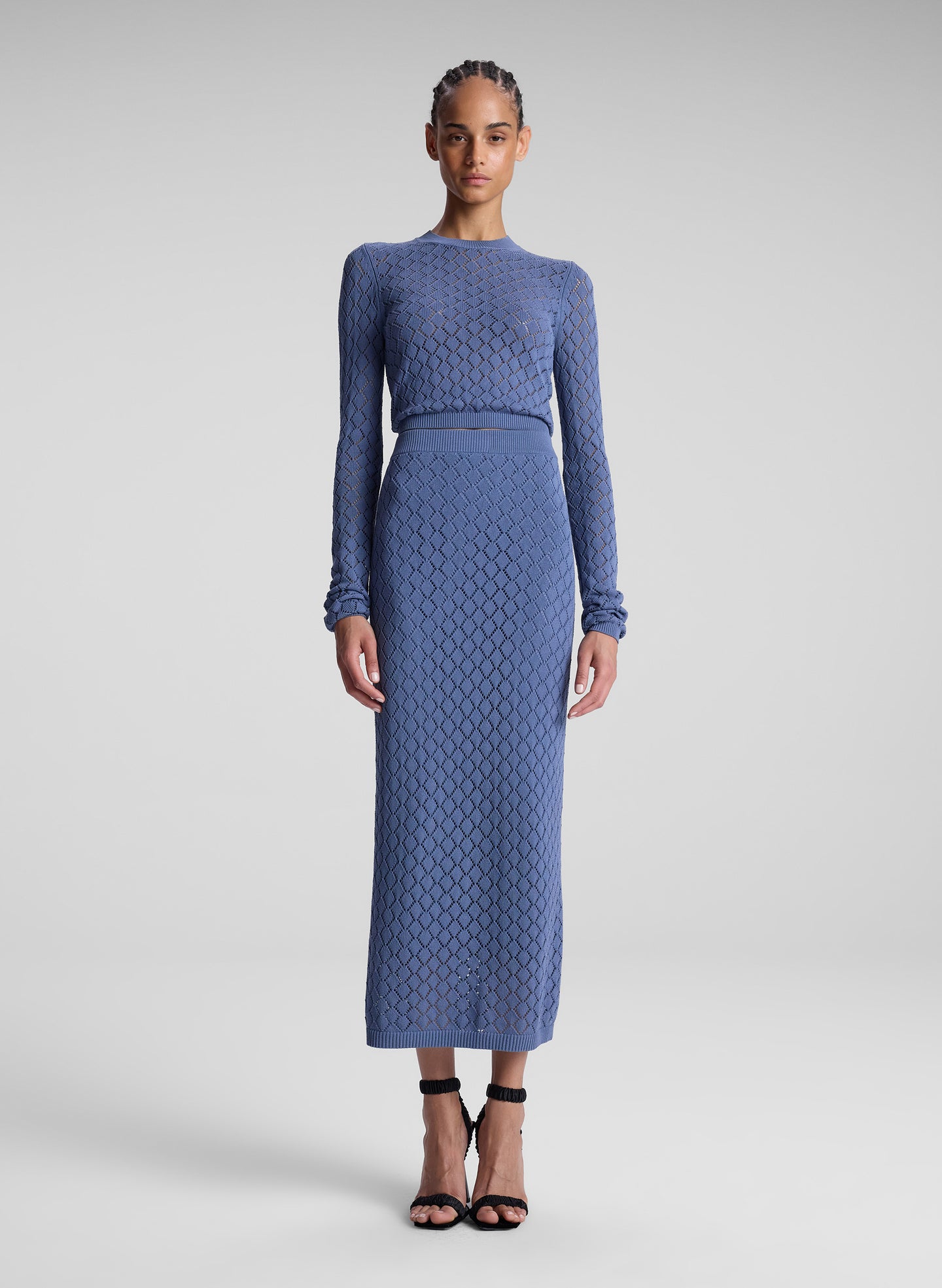 woman wearing steel blue knit skirt set