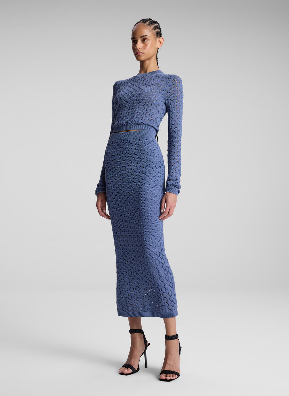 woman wearing steel blue knit skirt set