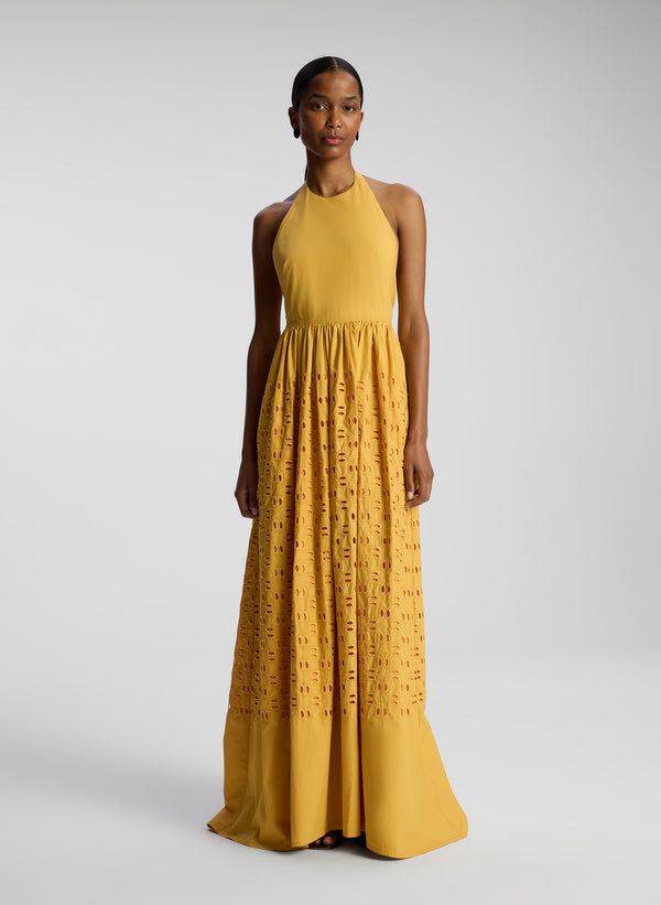 front view of woman wearing yellow maxi dress
