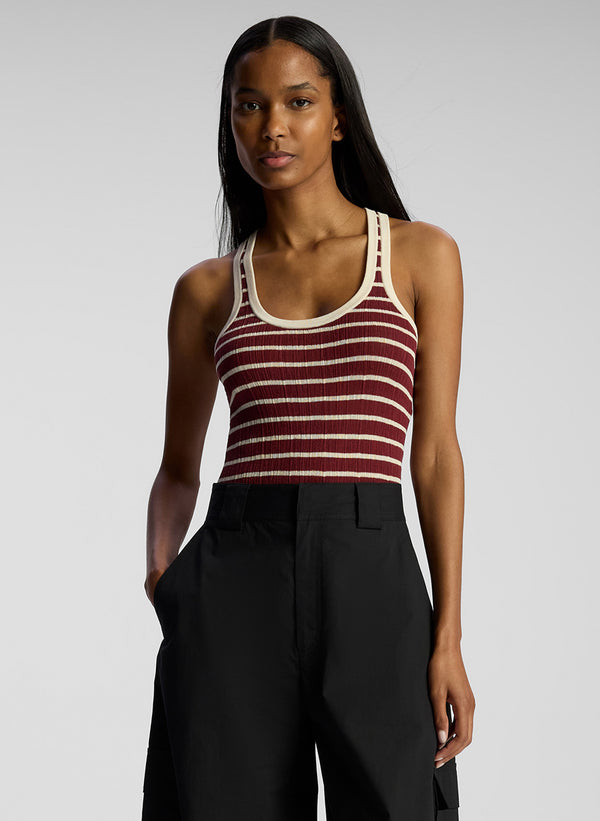 front view of woman wearing burgundy striped tank top and black cargo pants