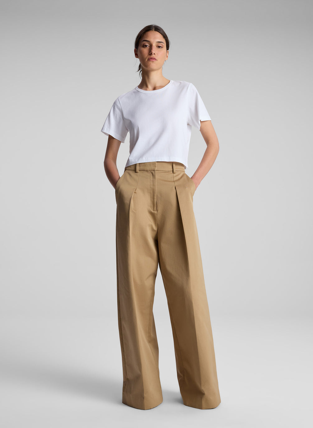 woman wearing white t shirt and khaki pants