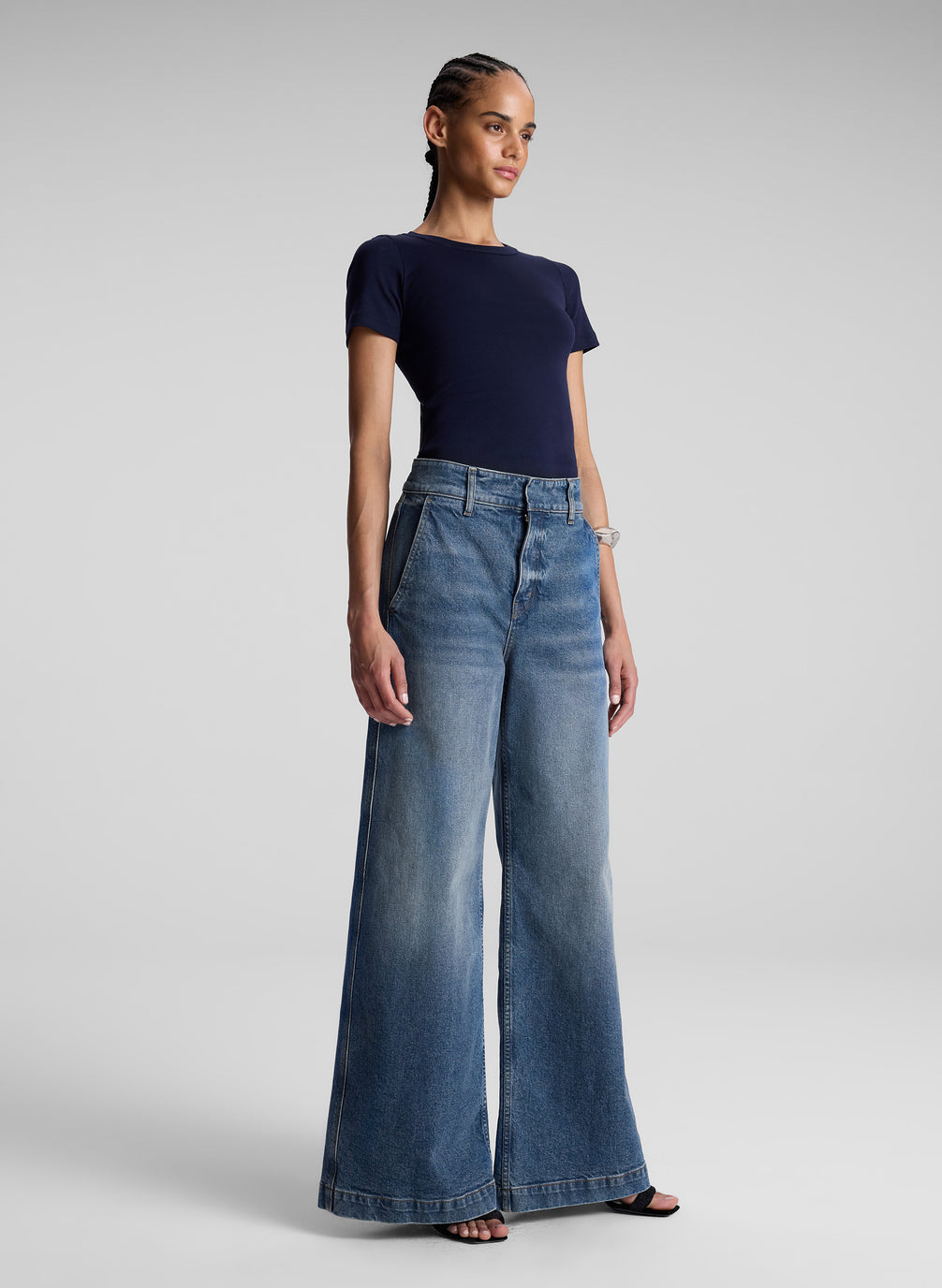 woman wearing navy blue tshirt and wide leg jeans