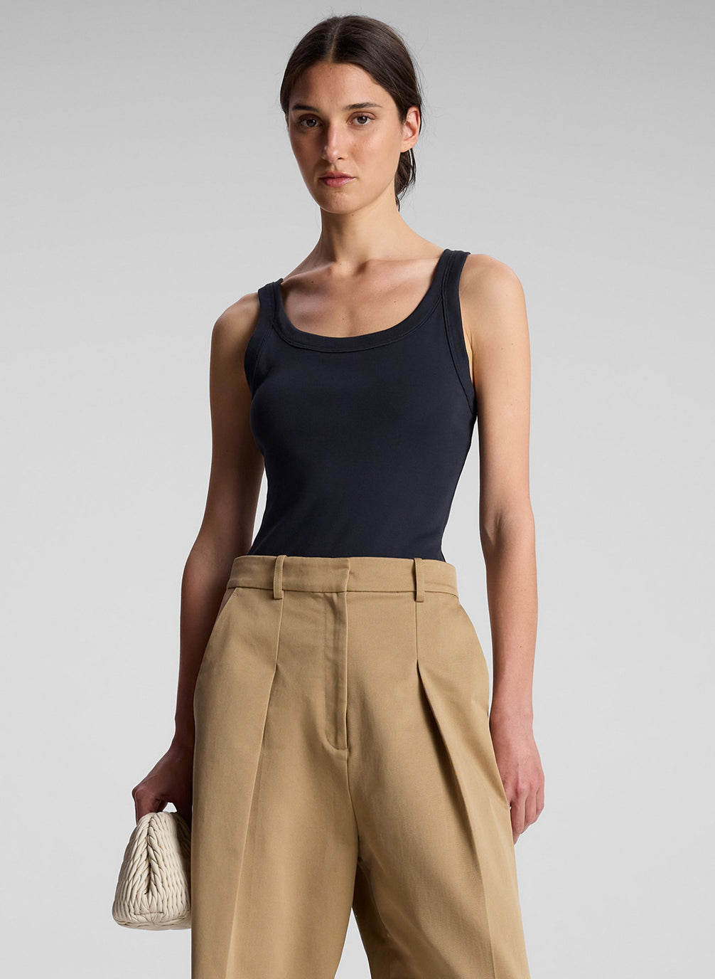 woman wearing black tank top and khaki pants