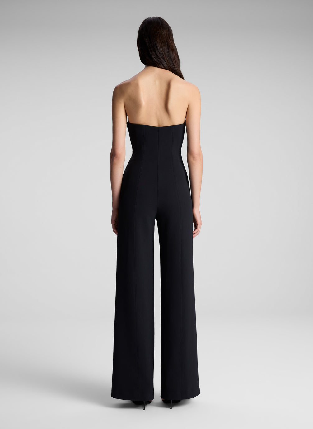 woman wearing black strapless jumpsuit