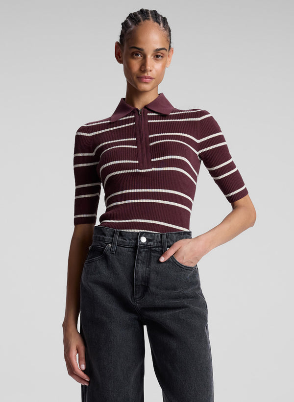 woman wearing carob striped shirt and jeans