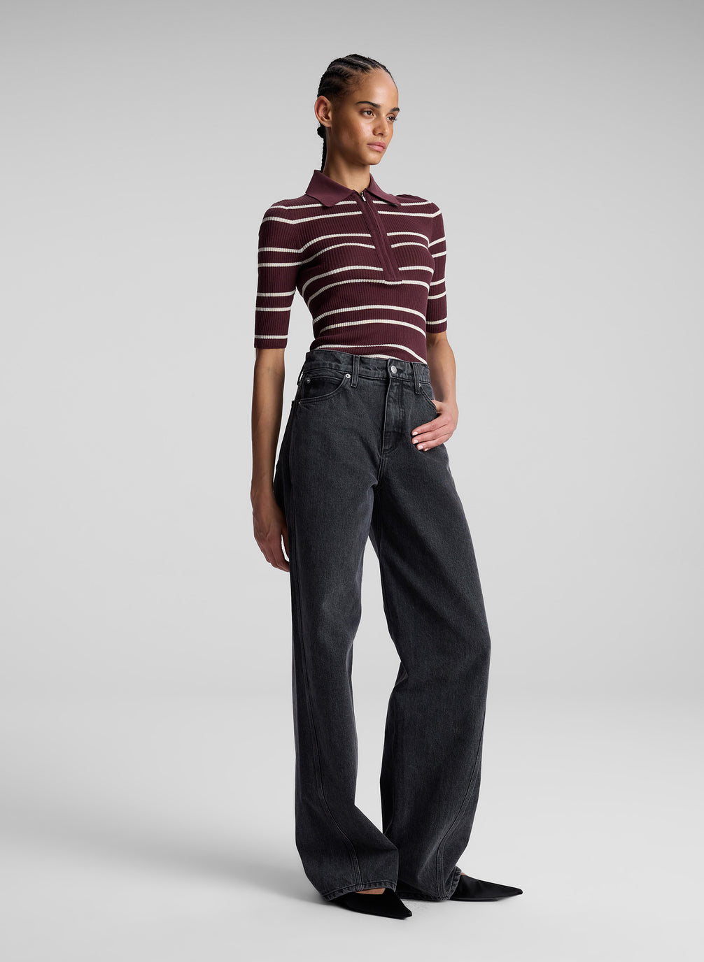 woman wearing carob striped shirt and jeans