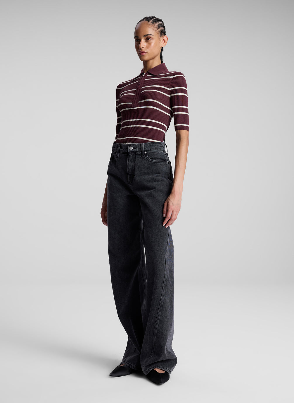 woman wearing carob striped shirt and jeans