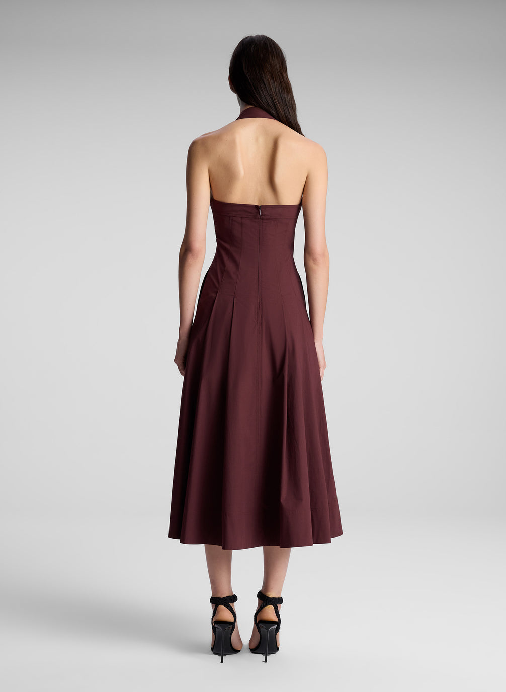 woman wearing brown halter dress