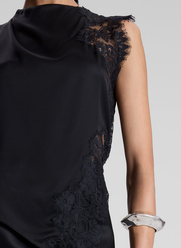 woman wearing black satin and lace tank with black skirt
