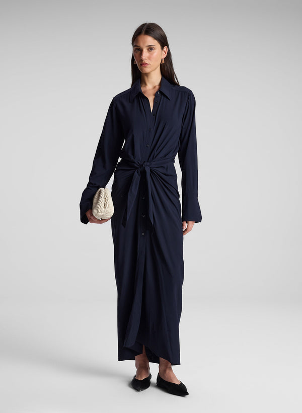 woman wearing navy blue maxi shirtdress