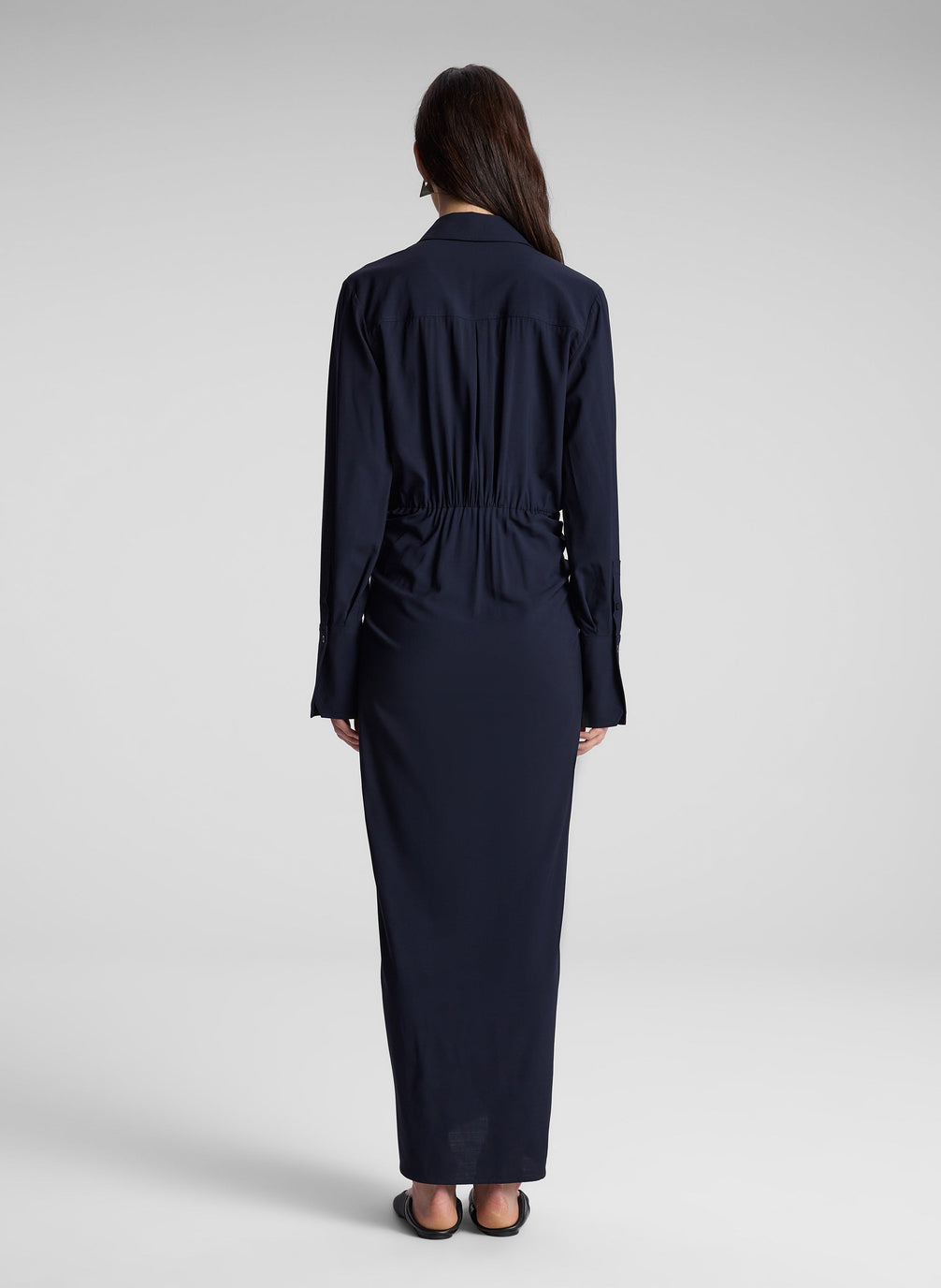 woman wearing navy blue maxi shirtdress