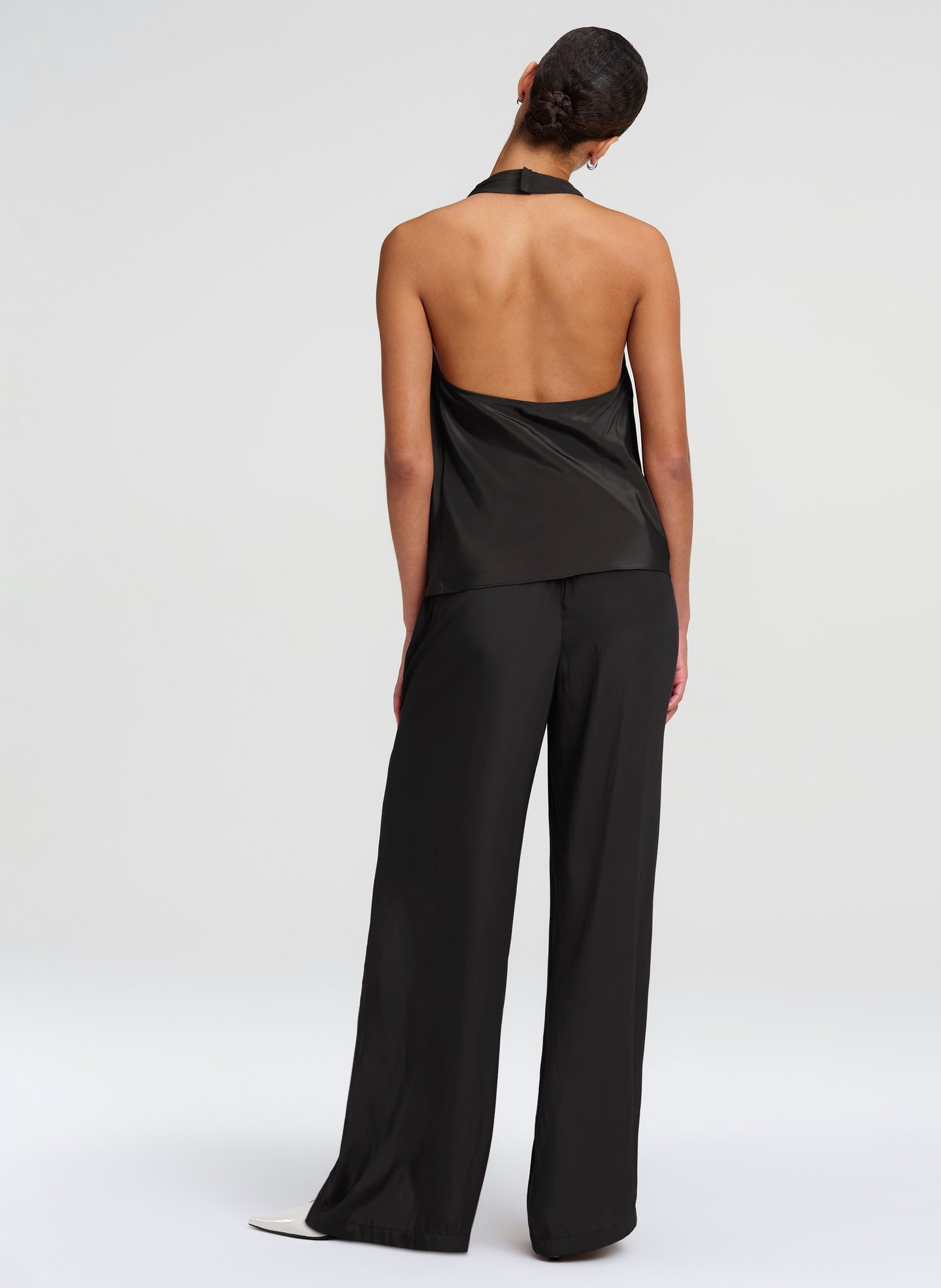 woman wearing black halter top and black pants