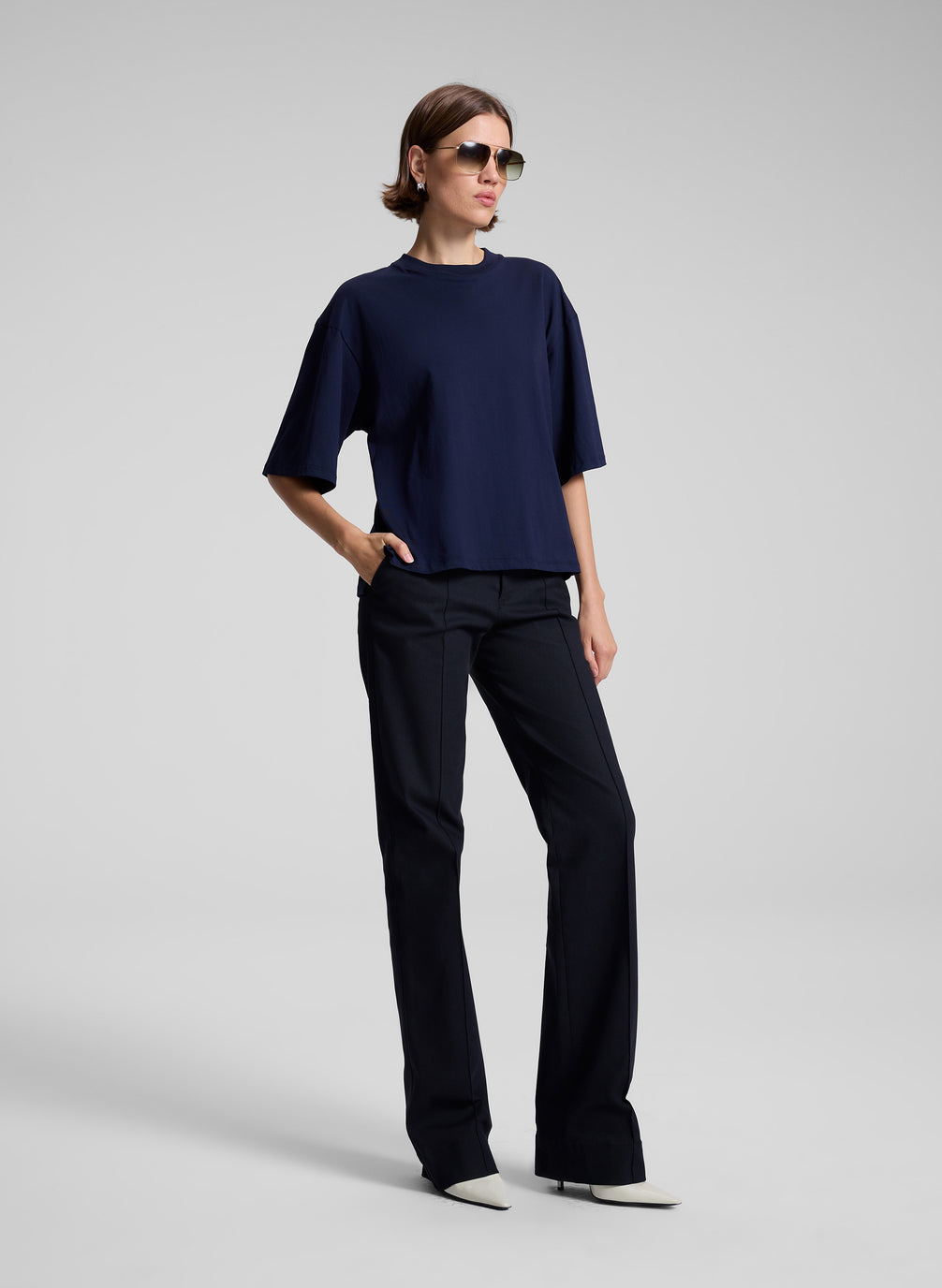 woman wearing navy t shirt and navy blue pants