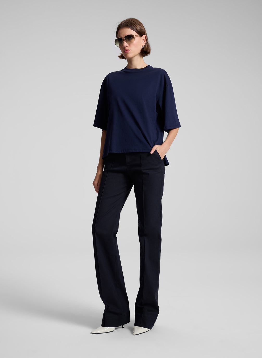 woman wearing navy t shirt and navy blue pants