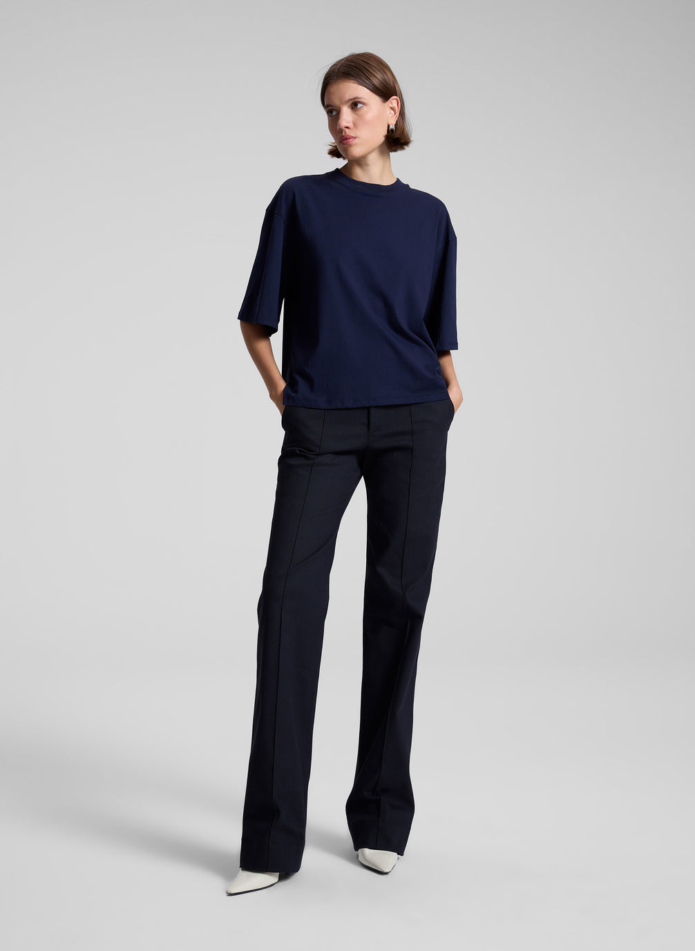 woman wearing navy t shirt and navy blue pants