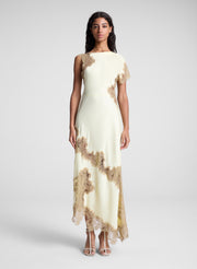 woman wearing butter yellow satin and lace maxi dress