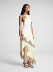 woman wearing butter yellow satin and lace maxi dress