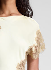 woman wearing butter yellow satin and lace maxi dress