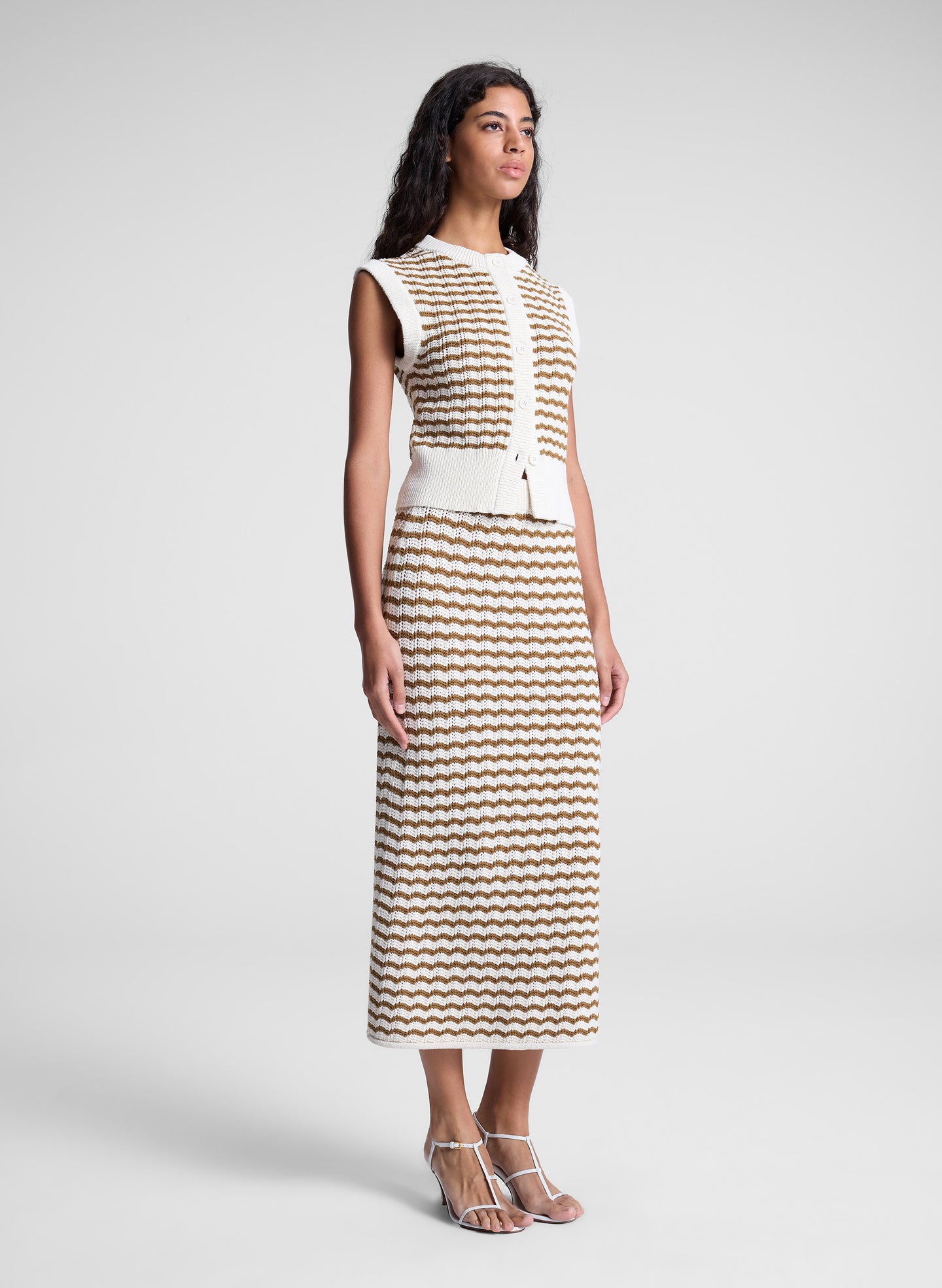 woman wearing striped knit skirt and shirt set