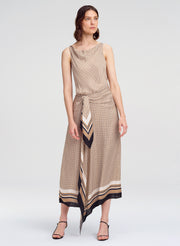 Woman wearing a patterned dress on a white background