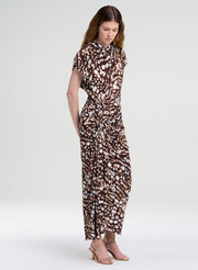 woman in brown print midi dress with sleeves