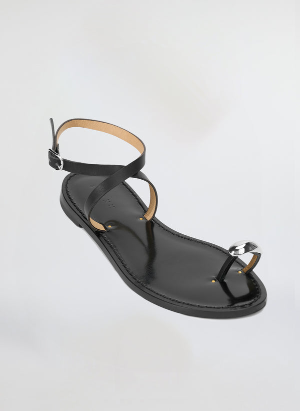black sandal with silvertone toe embellishment 