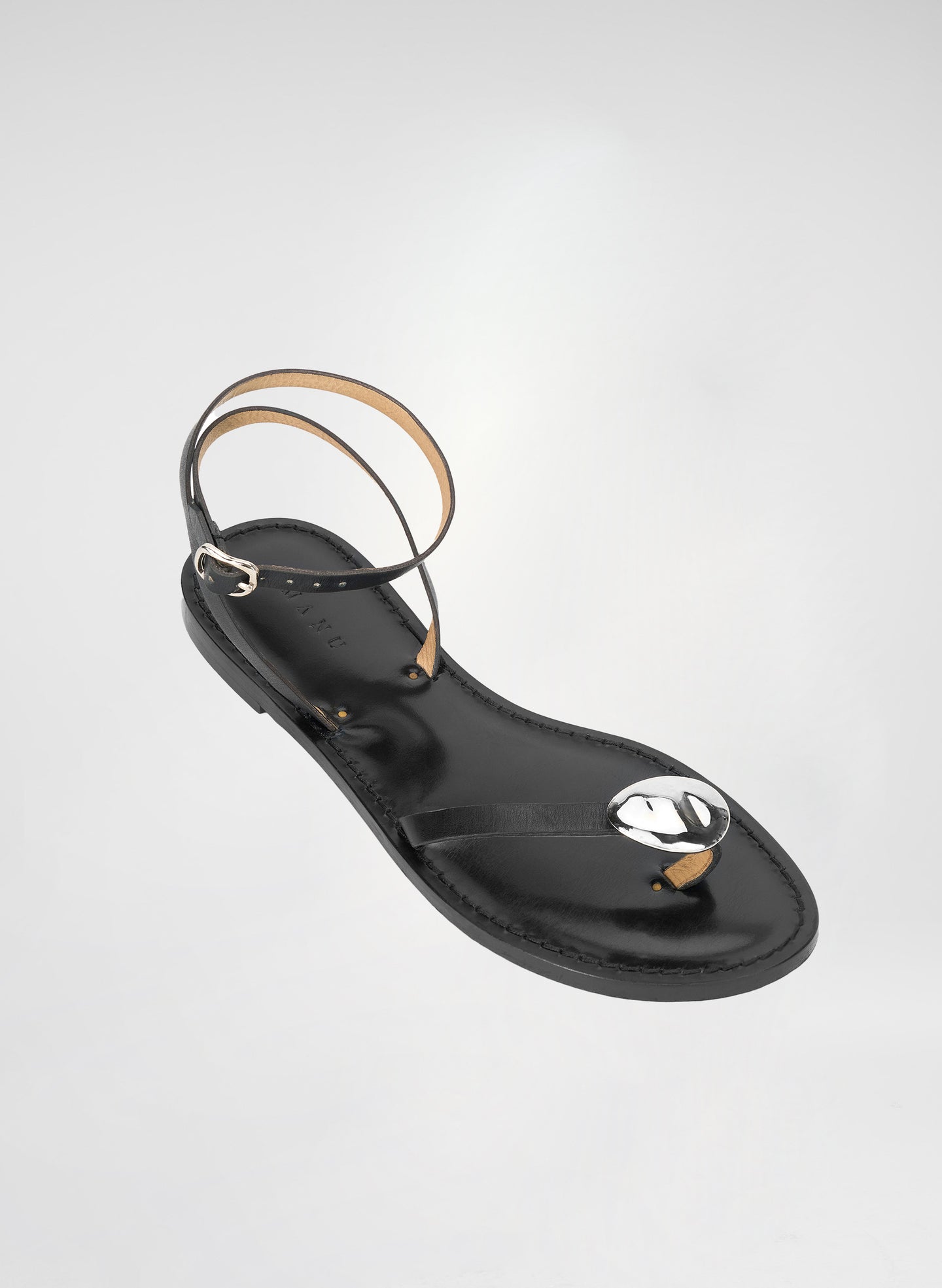 black sandal with nickel accent